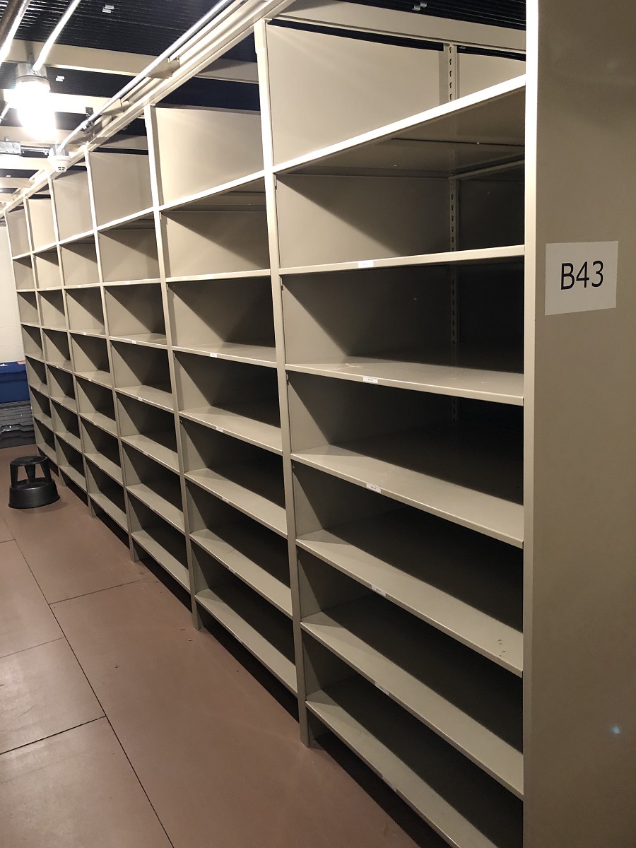 Empty shelving in The Henry Ford's archives, ready for Lillian Schwartz material Long set of empty shelves