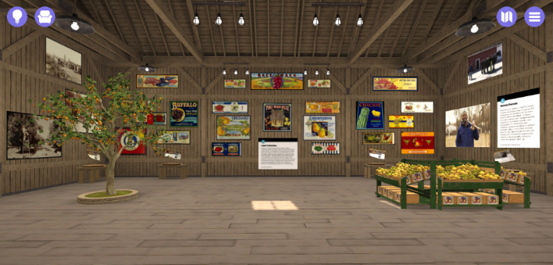 Barn section of The Henry Ford’s Entrepreneurship Sagan Barn-like space with orange tree growing on left side, crates of fruit on right side, various images on walls