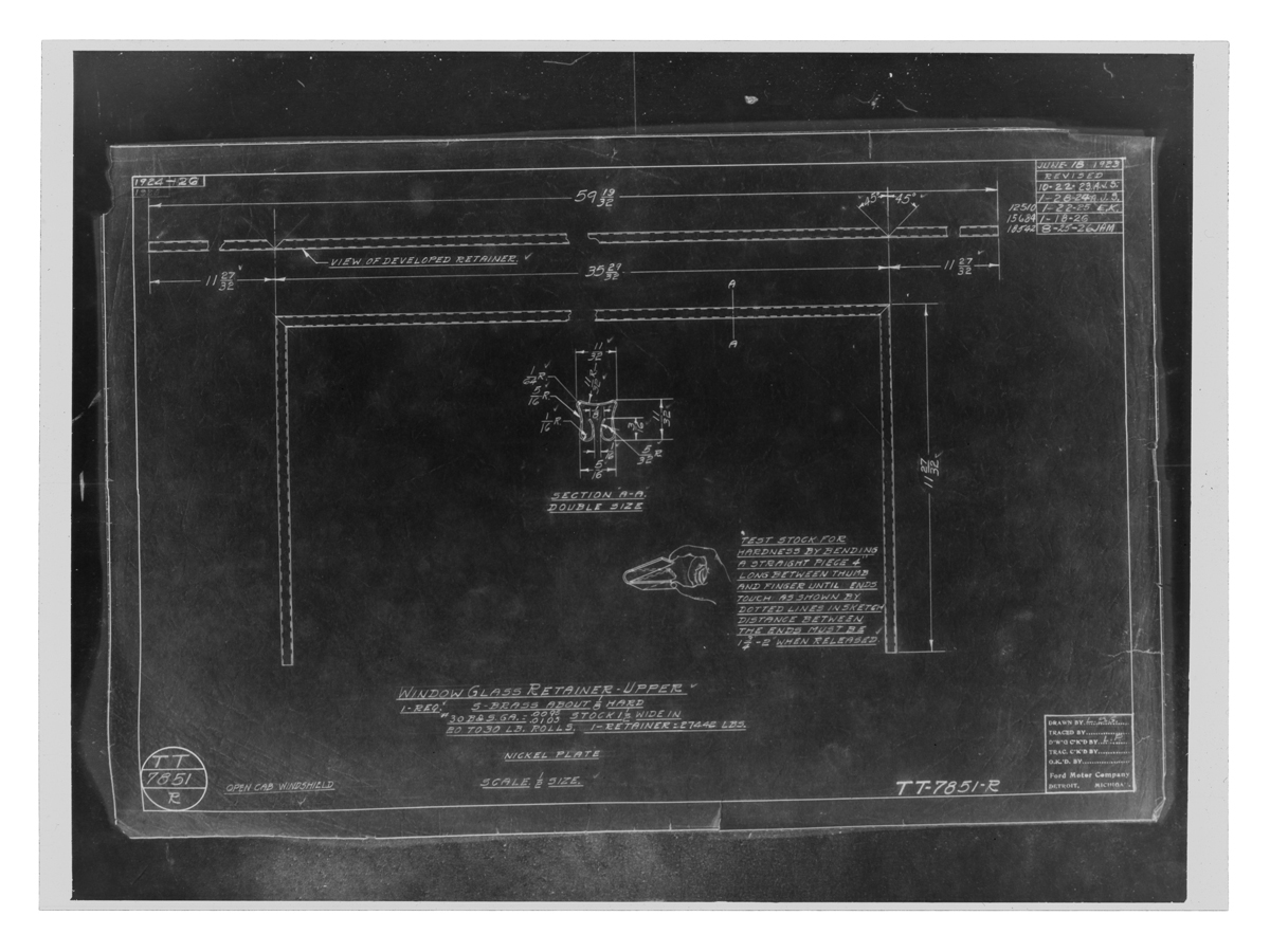 Dark background containing white line drawings, notations and text