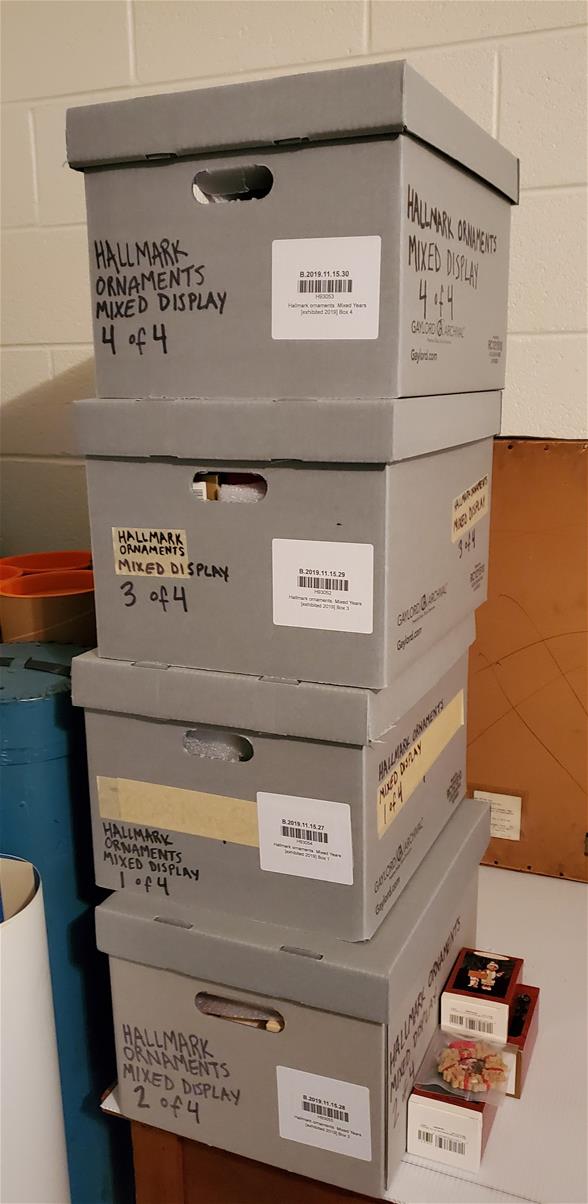 Four gray boxes in a stack