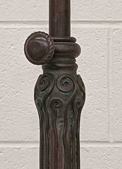 GIF showing two images of part of a lamp stem; the first is dark and dull and the second is lighter and shiny