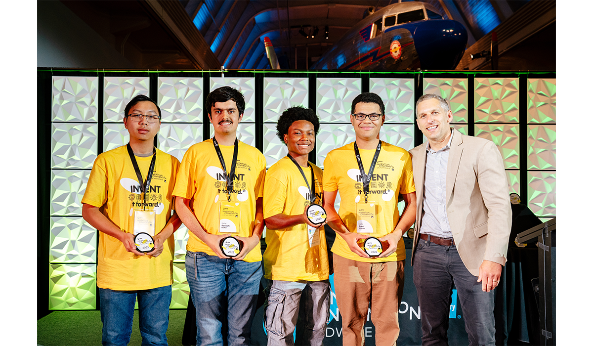 The team of Zander Yang, Ravinath Boulton, Ashon Carter and Grant Richmond accept their Patent Application Award, presented by Cooley, for their invention GroundLock. Photo by Nick Hagen.