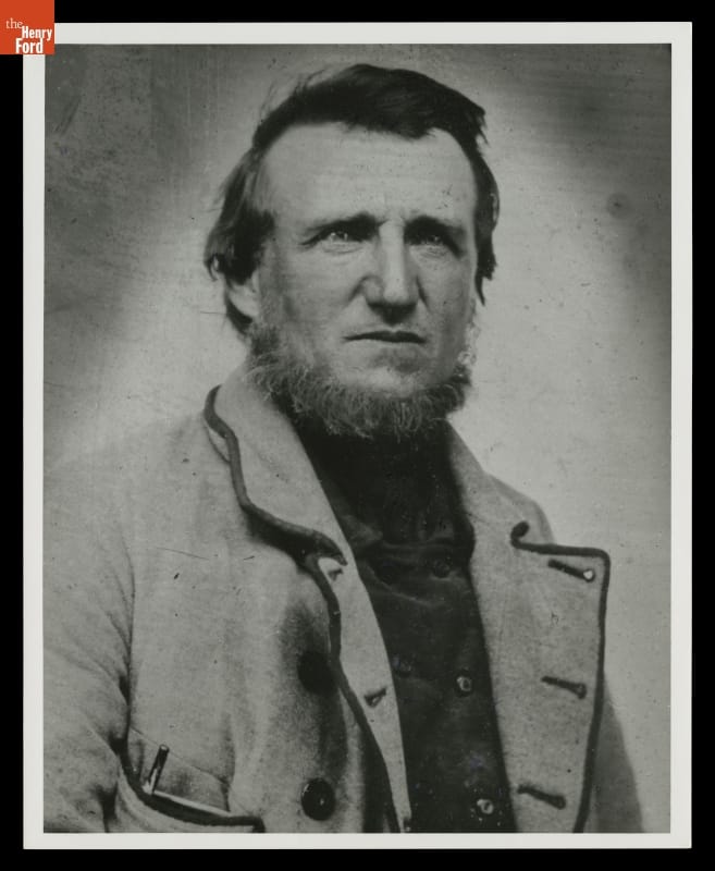 Man with beard wearing coat