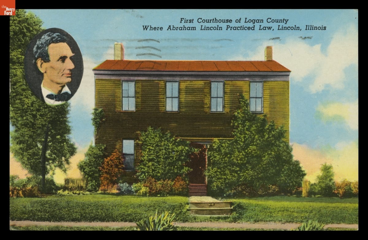 Color postcard of two-story wooden building, inset oval portrait of a man's profile, and text