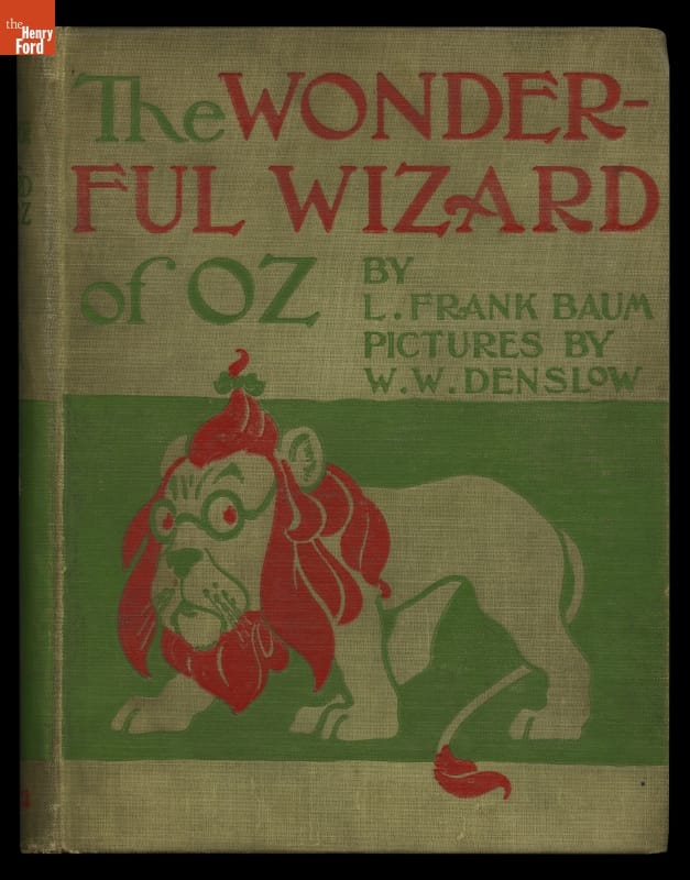 Green, red, and beige cover with illustration of lion and text