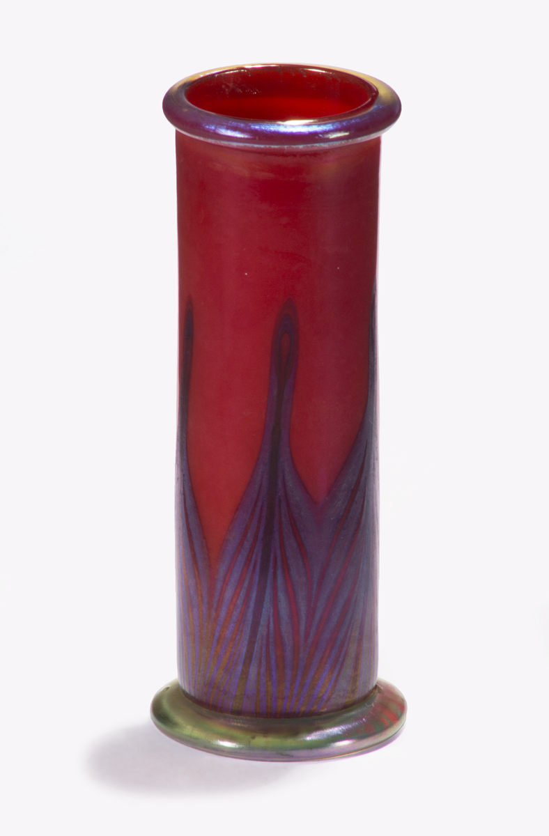 Narrow red vase with blue-and-red abstracted "peacock feather" pattern on bottom