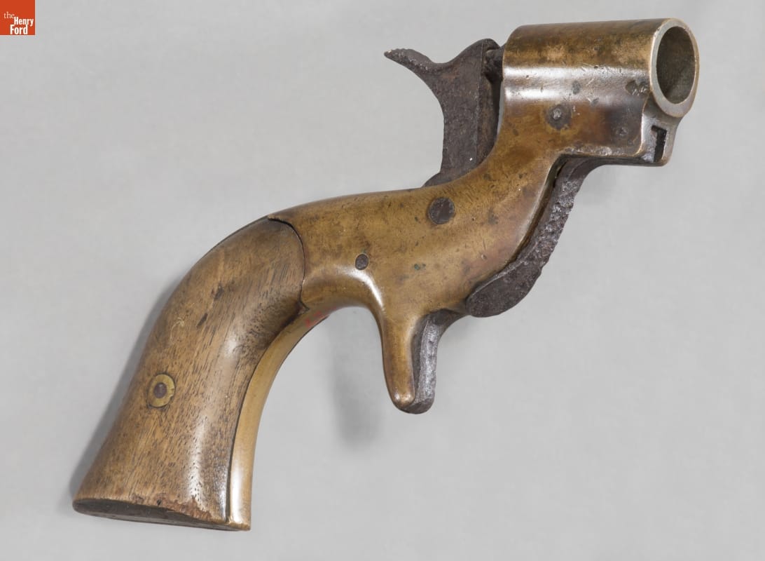 Gun with wooden stock and very short barrel