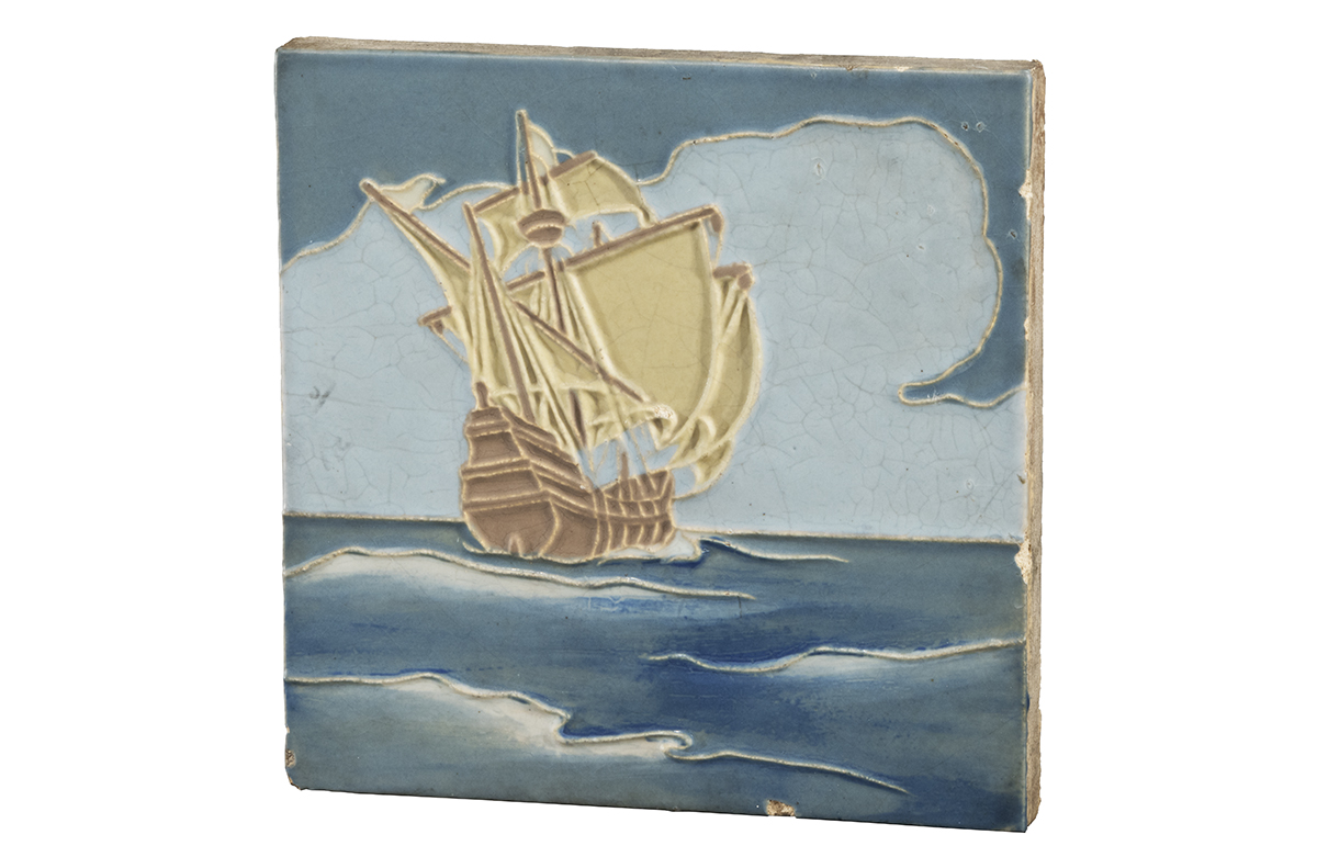 Square tile with image of ship sailing on a blue sea against a blue sky with clouds