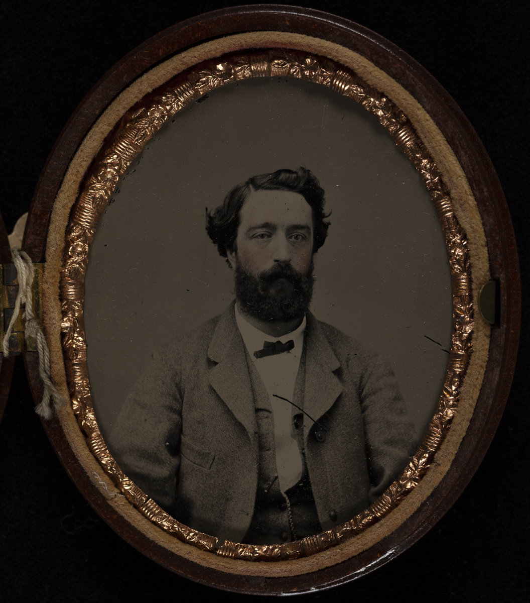 Man with a Beard, 1870-1879 Torso and head of a man with a beard wearing a suit, in an oval frame