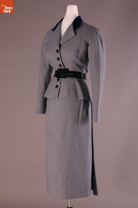 Suit, Worn by Elizabeth Parke Firestone, 1949-1950 Long gray skirt and gray jacket with black belt, buttons, and collar