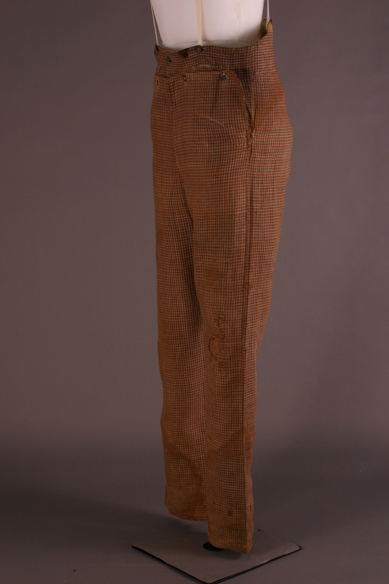 Brown pants with a houndstooth or checked pattern
