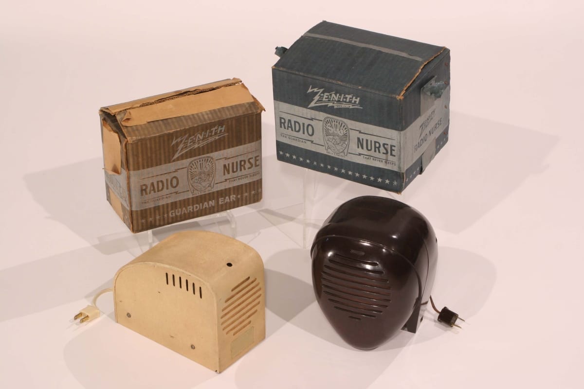 Zenith Radio Nurse, 1938 Four components: two boxes (each containing text), a beige piece with a plug and grille, and a teardrop-shaped piece with a plug and grille