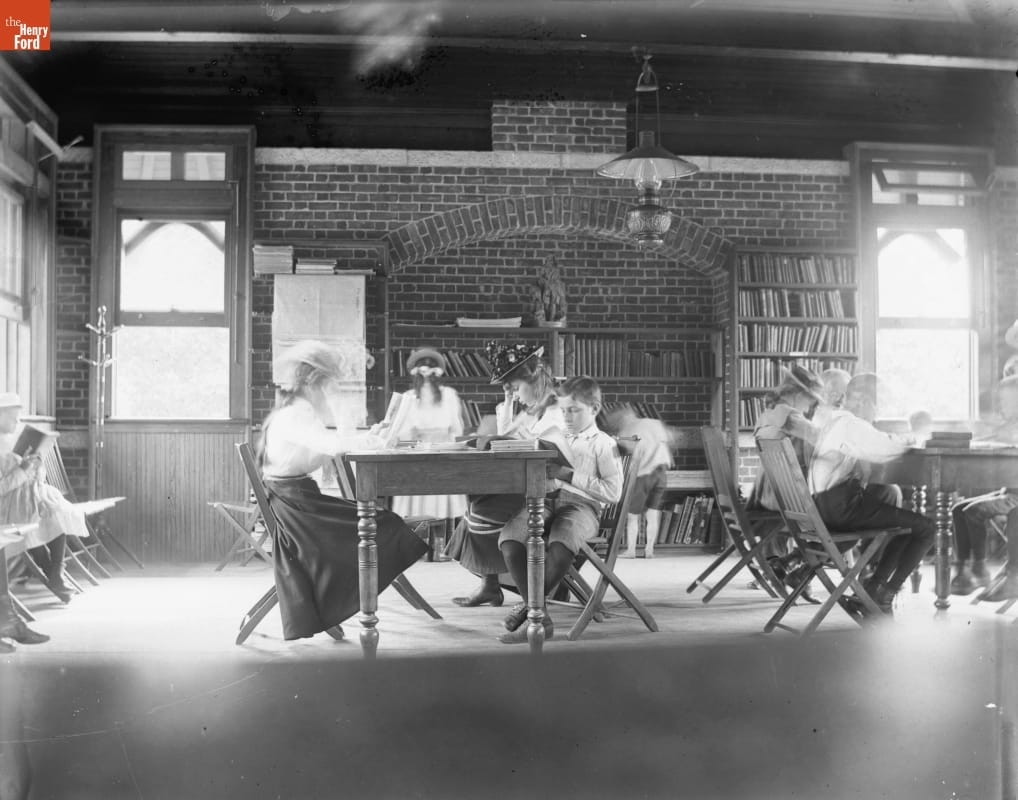 Library, Tompkins Park, New York, circa 1910 Photo taken by Jenny Young Chandler of young people sitting at tables and reading in the library in Tompkins Park, New York in 1910