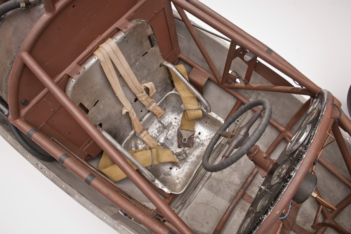 1951 Beatty Belly Tank Lakester Land Speed Race Car / cockpit Looking down into car's open cockpit from above, with simple metal seat with harness attached