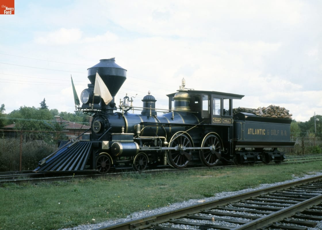 Steam Locomotive "Sam Hill," 1858 Locomotive on train tracks